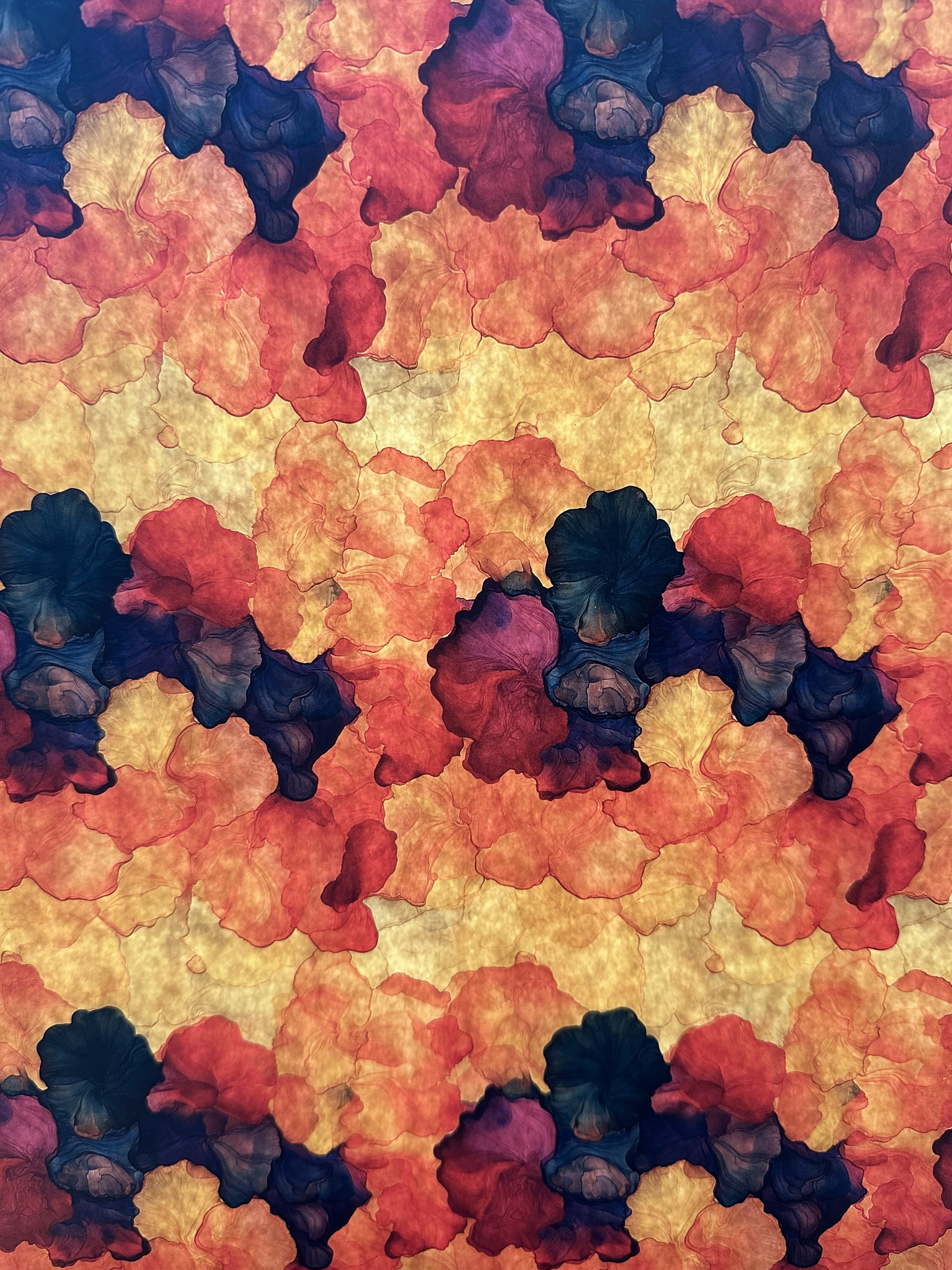 Colorful abstract pattern with shades of red, orange, and purple.